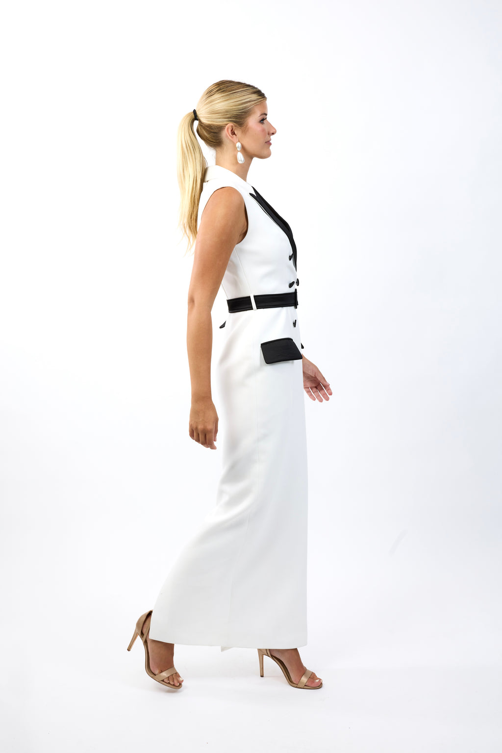 Tuxedo dress side view showing the floor length structured silhouette
