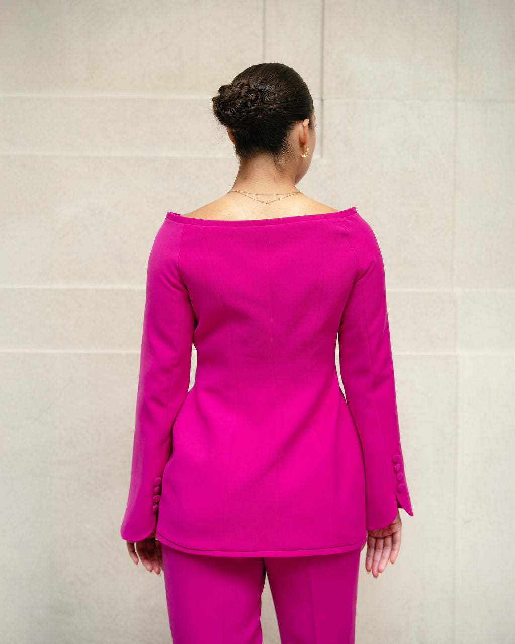 Back view of Nova pink blazer with clean structured tailoring