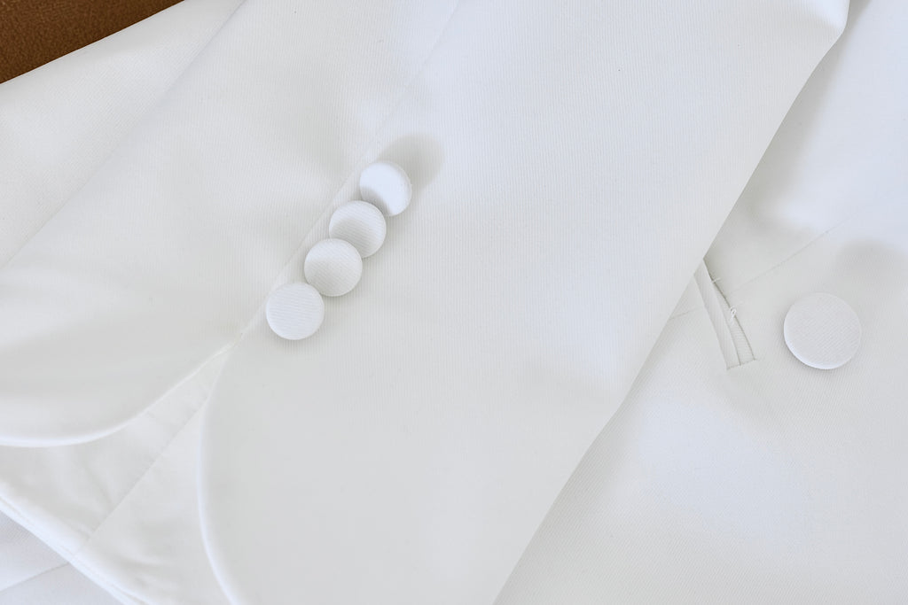 Close-up of sleeve detail on Nova white women’s blazer